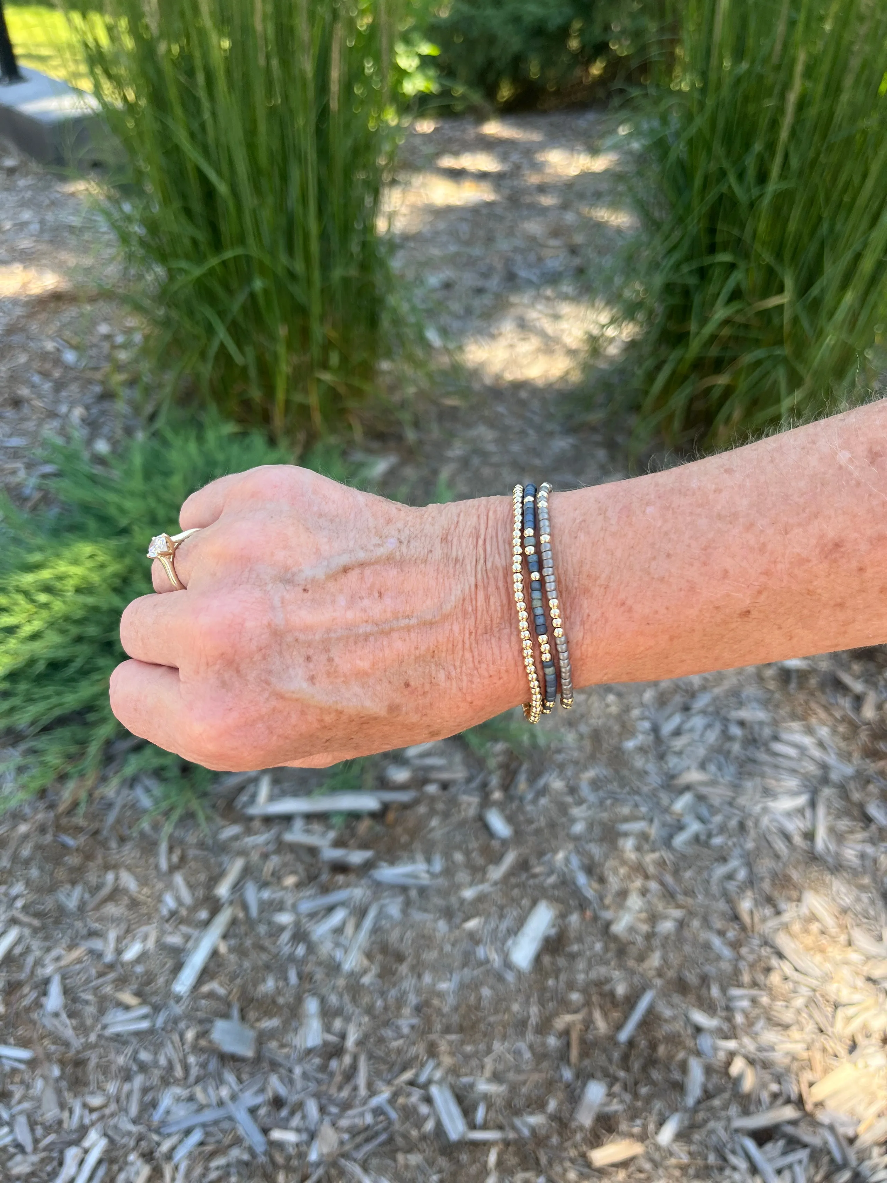 Japanese Toho Seed & Gold Stretch Bracelet - Matte Gun Metal Grey